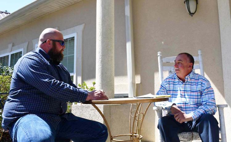 Nathan Dodd (left) receives counseling from licensed counselor Mark Beach. BRIAN WELLMEIER/Staff