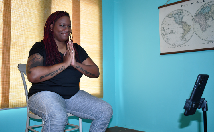 Corynne Stewart engages her yoga class via Zoom from her Clarkesville home. BRIAN WELLMEIER/Staff