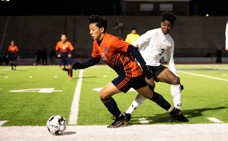 Habersham Central’s Xavier Lopez takes the ball from a Lanier player on Feb. 18. RAEGAN TURNER/Special