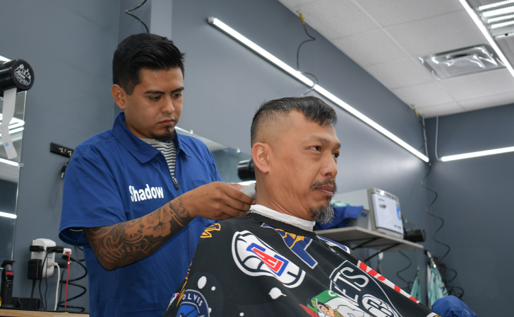 Shadow Navarrete makes all the right trimmings for Ty Kinnarath’s haircut. BRIAN WELLMEIER/Staff