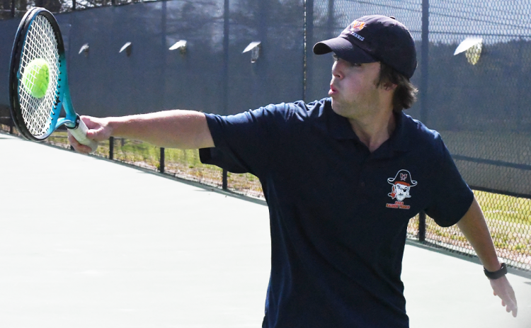 Senior and No. 1 singles player Ray Carr connects with a ball during his match in the first round of the state playoffs. CODY ROGERS/Staff