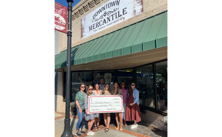The Downtown Mercantile was the recipient of a facade grant for a new sign. Left to Right: Lindsey Holt, Emily Herrin, Jessie Owensby, Heath Barrett, Breanna Meister, Nicole Davis, Sarah Higgins, and Cagney Meads. LINDSEY FITZGERALD/Submitted