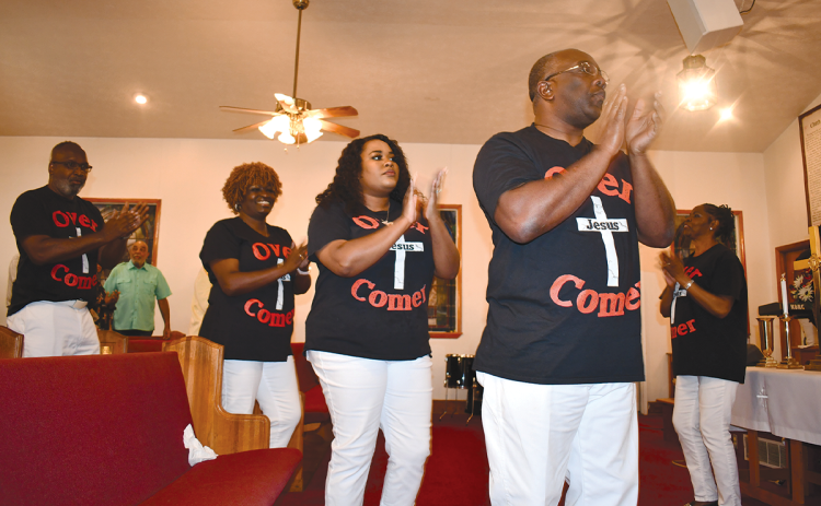 Far right is Dr. Vanessa Burns, Shady Grove Missionary Baptist Church’s choir Director. In front are (from left) Bishop Ernest Burns, Lisa Camp, Elder Shasmon Colbert, and Deacon Randy Hatcher as all four come into the church Sunday for the Choir Day celebration. BRIAN WELLMEIER/Staff