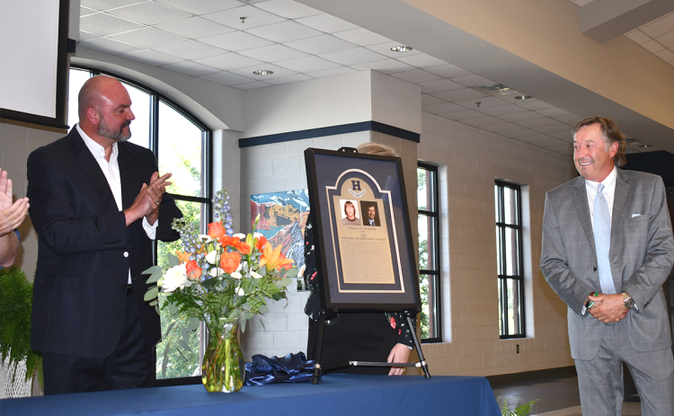 Superintendent Matthew Cooper (left) applauds Marlan Wilbanks on his lifetime achievement award at Habersham Central High School at a ceremony Friday. Wilbanks is the third such recipient since the award’s inception. BRIAN WELLMEIER/Staff