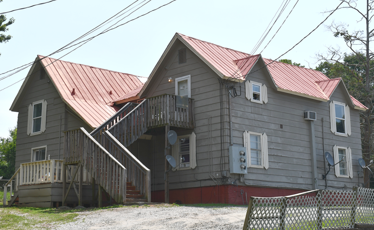 A wheelchair-bound woman and her autistic son were forced to vacate this home on King Street in Baldwin. BRIAN WELLMEIER/Staff