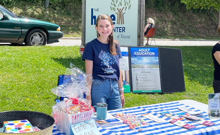 Family Support Specialist Campbell Weidemeier works a  station at a resource fair at Hope Center in Toccoa. MELANIE ALLEN/Submitted