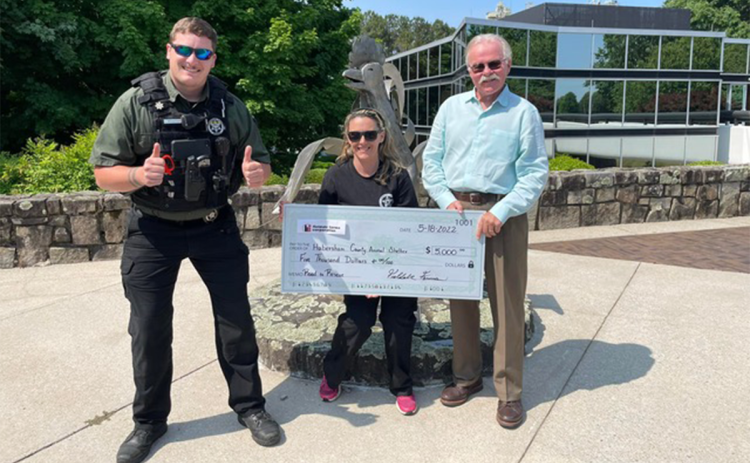 Tom Hensley, President of Fieldale Farms, presents HCACC Director Madi Nix and former employee Chris Broadway with a $5,000 Donation to the Road to Rescue Campaign. HABERSHAM COUNTY/Submitted