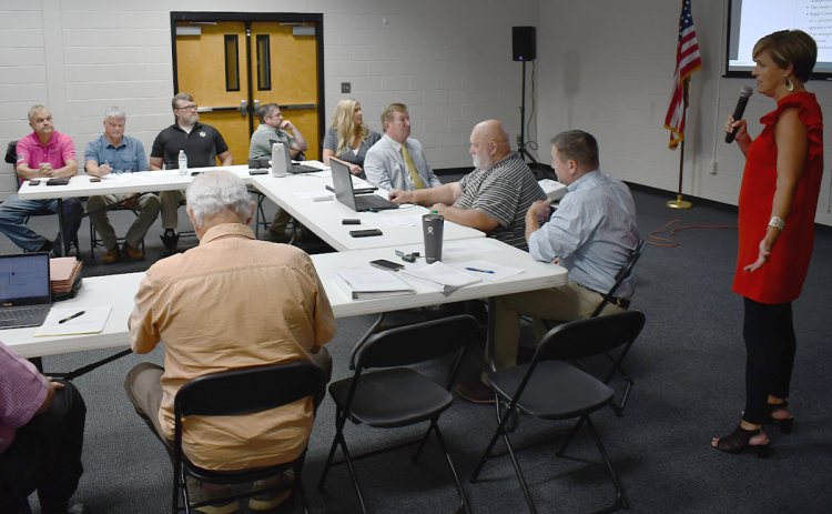 Habersham County Manager Alicia Vaughn (right) makes a presentation to the county  commission and the Tallulah Falls Town Council on Tuesday night. MATTHEW OSBORNE/Staff