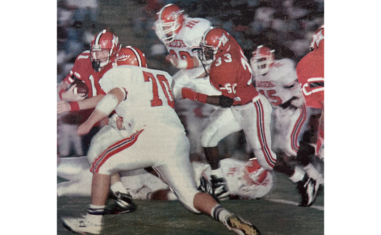 Habersham Central’s Bill Simmons (70) closes in on Stephens County quarterback Benji Harrison, now the head coach of the Raiders, in a 1993 contest that was Habersham’s most recent road win against Stephens County. FILE