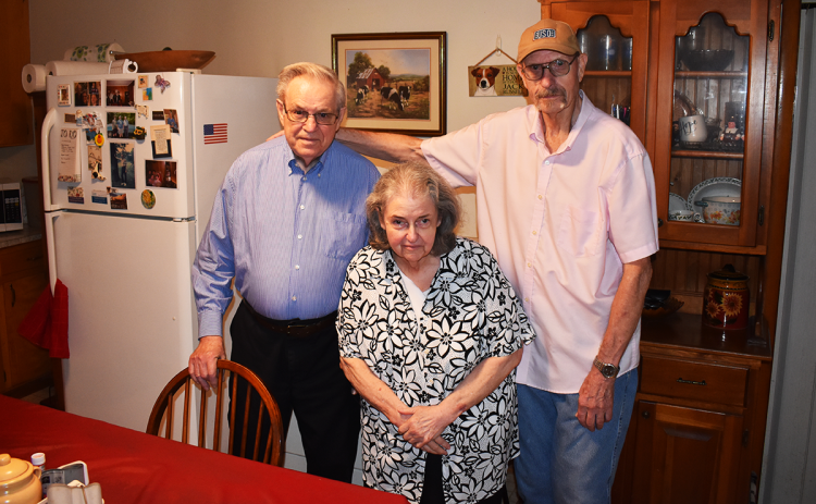 Charlie and Mary Wood get their daily hot meal delivery from Meals on Wheels volunteer Virgil Williams, of Clarkesville, with whom they have developed a friendship. AMARIS E. RODRIGUEZ/Staff