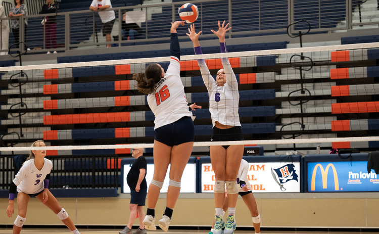 Callyn Chosewood (16) lands a spike through a West Forsyth defender to tie up the set. ZACH TAYLOR/Special