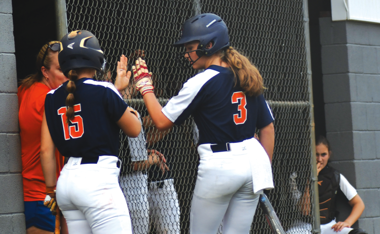 Habersham’s Bailey Barfield  receives congratulations from fellow senior Joni Littlejohn and head coach Karly Thompson after scoring in the Lady Raiders’ 7-2 road victory over Rabun County on Wednesday. LUKE MOREY/Clayton Tribune