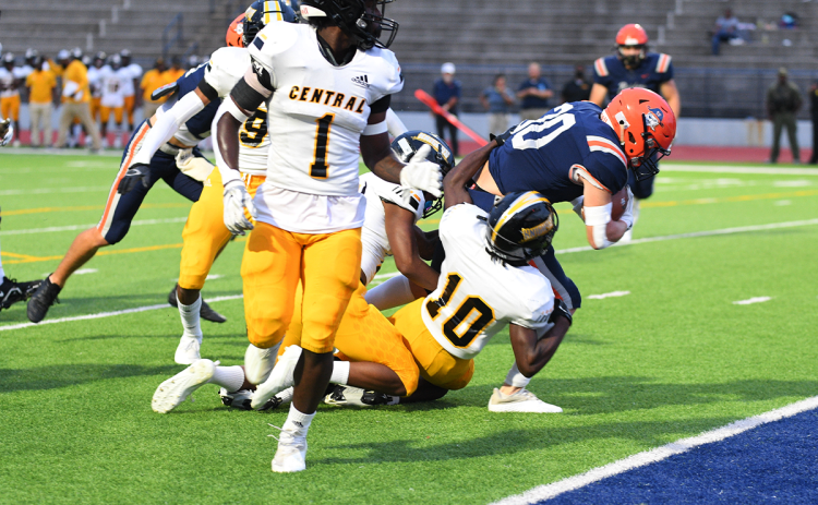 Habersham Central’s Blandon Grizzle plows forward through Central Gwinnett defenders for a touchdown last Friday night. TOM ASKEW/Special