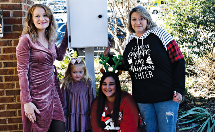Marilon Lostin, and daughter Monroe Lewallen display their first pantry at Habersham County Senior Center with Kayla Ellis and Kathy Holcomb. JOHN DILLS/Staff