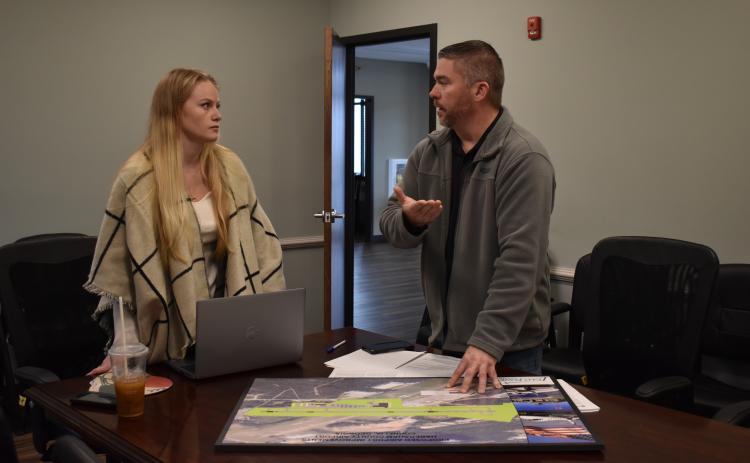 Habersham County Grant Coordinator Lauren Long discusses the future of Habersham County Airport with Airport Manager Will Regan on Thursday. EMMA MARTI/Staff