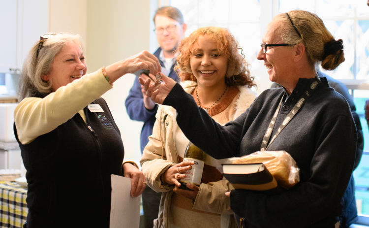Habitat for Humanity Executive Director Nanette Baughman (left) hands the keys to new homeowner Lisa Thomas. ZACH TAYLOR/Special