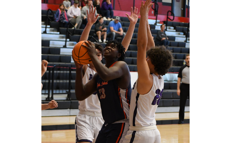 Habersham Central’s JoJo McCurry is surrounded by defenders against  Walhalla in the Raiders’ last game before the new year. MATTHEW OSBORNE/Staff