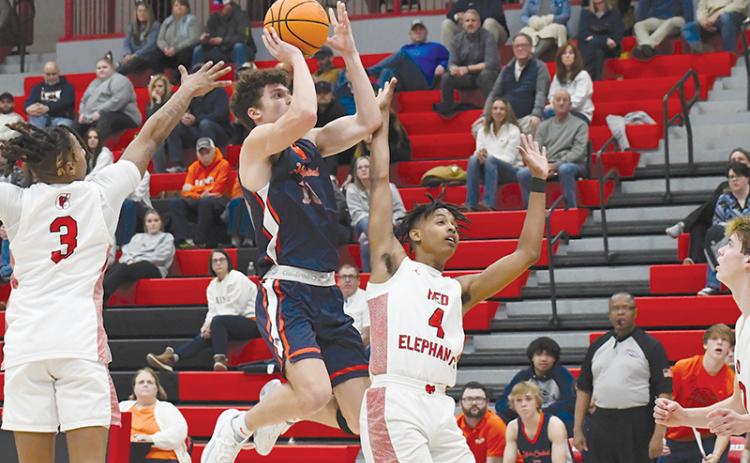 Habersham Central's Cole Gary floats in the air on the way to the basket Friday night.