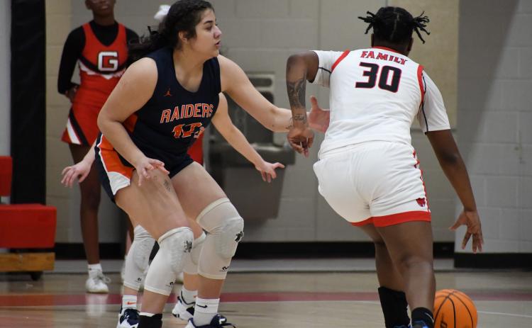 Habersham Central’s Gabby Santiago (left) defends a Gainesville’s Kedra Young during Friday night’s game. MATTHEW OSBORNE/Staff