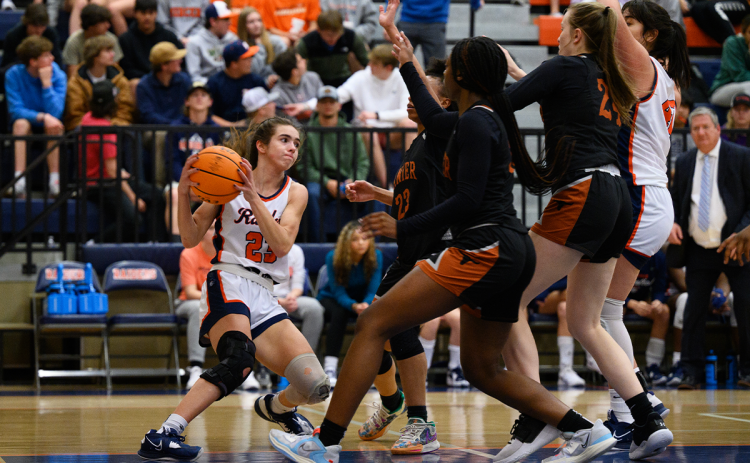 Habersham Central’s Kyia Barrett draws a crowd from the Lanier defense just before escaping it with an out-pass to Emyrie Combs. ZACH TAYLOR/Special