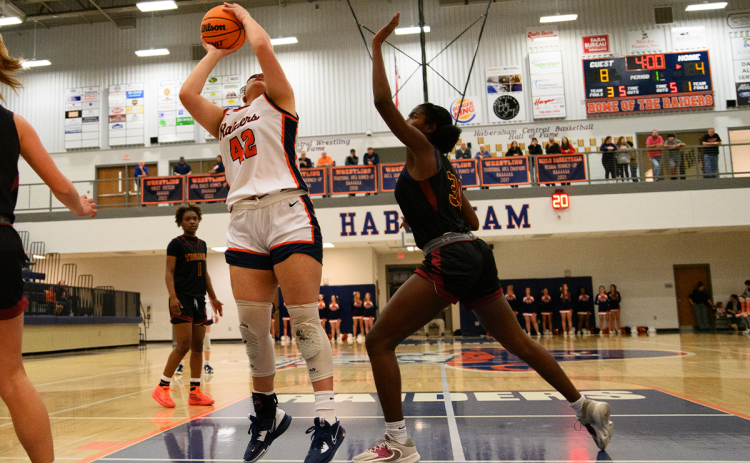 Habersham Central’s Gabby Sanitago goes to the hoop during her monster first half on Tuesday night. The senior scored 8 points in the first half and 13 overall to help the Lady Raiders reach the second round. ZACH TAYLOR/Special