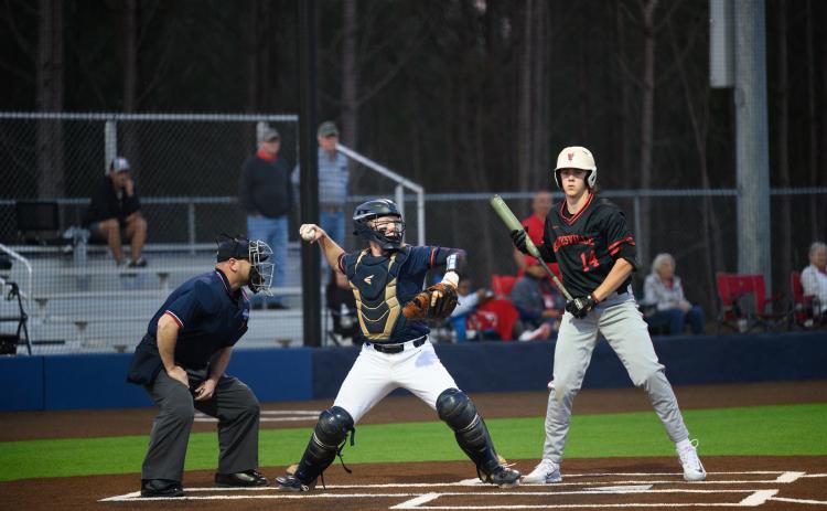 Habersham Central’s Blandon Grizzle fires down to second to nail a runner against Gainesville on Monday. ZACH TAYLOR/Special
