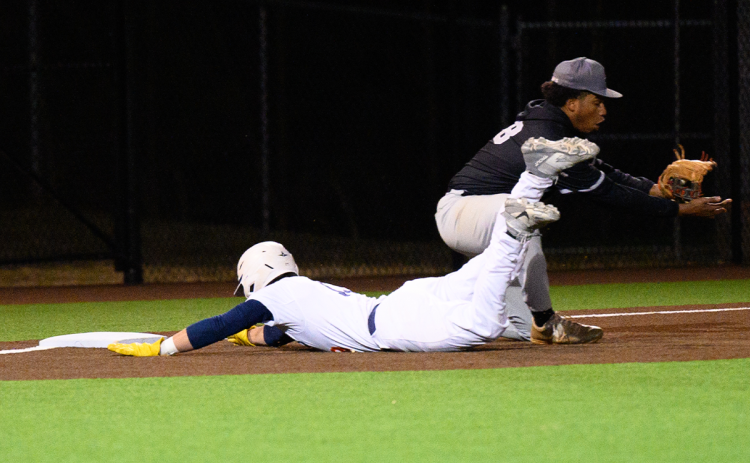 Raiders shortstop Cooper Shirley slides safely into third after hitting a triple that rolled to the wall at Raider Park against Shiloh on March 13. ZACH TAYLOR/Special