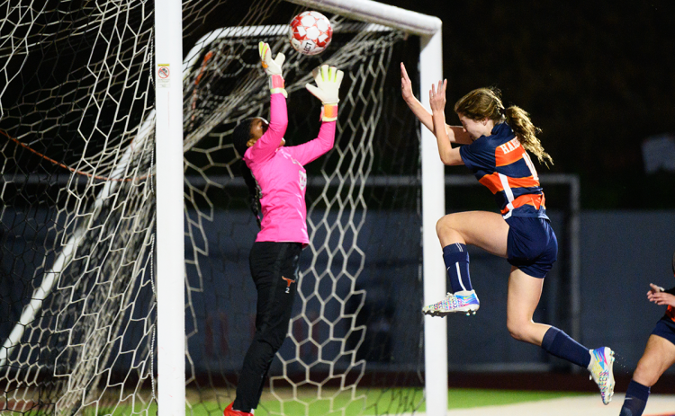 Abby Hotard floats toward the Lanier goalie for the game-winning header in Friday night’s region match. ZACH TAYLOR/Special