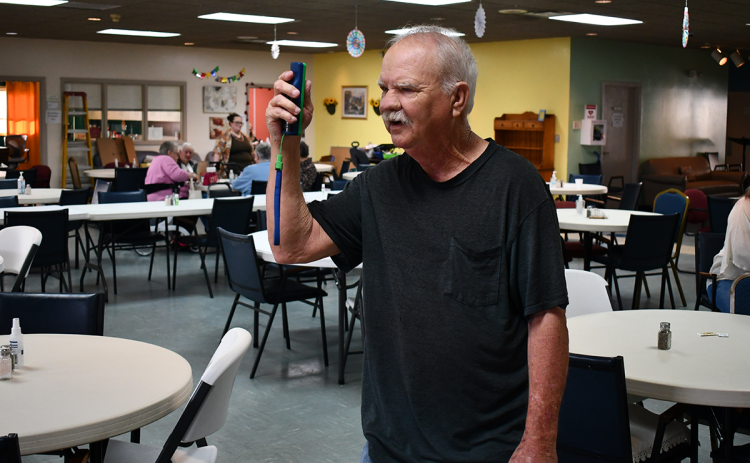 Kenneth Williams, a member of the Habersham King Pins, takes some time to practice his Wii Bowling skills on Tuesday. JOHN DILLS/Staff