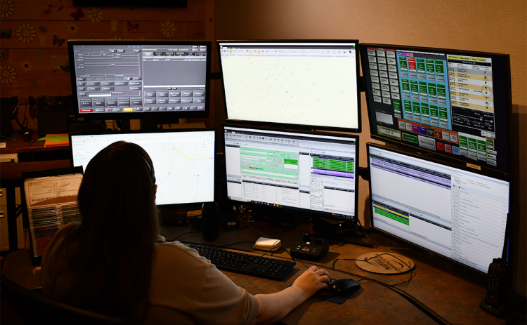 Habersham County 911 dispatcher Belinda Konarski checks out her many computer screens between phone calls. JOHN DILLS/Staff