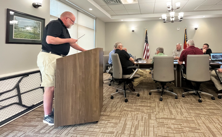 Bill Gresham reads his resignation to the Planning Commission on Tuesday night. JOHN DILLS/Staff