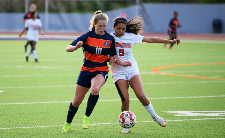 Raiders midfielder Addi Banks (10) fights to keep possession of the ball against Gainesville. ZACH TAYLOR/Special