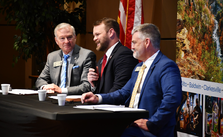 Habersham County state legislators (from left) Rep. Chris Erwin, Sen. Bo Hatchett and Rep.  Victor Anderson talk at Wednesday’s legislative breakfast at Habersham EMC. MATTHEW OSBORNE/Staff