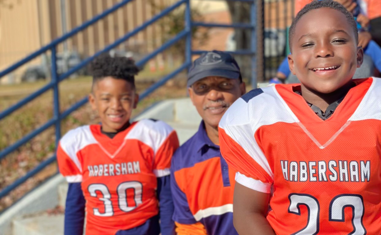 Bernard Trimiar (middle) is shown with his grandsons Brady and Brody during one of their Raider youth football games. Bernard has contributed as a coach, umpire and referee in addition to his Ring of Honor playing days of the 1970s. SUBMITTED