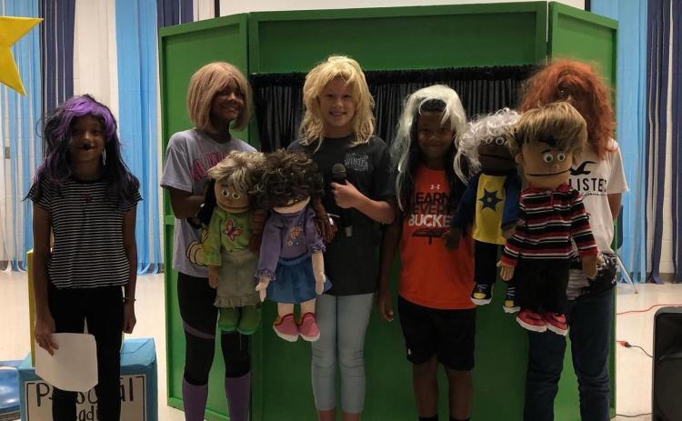 Cornelia Elementary students  London Garcia, Tinsley King, Ali Hartrick, Ty King and Steve Hernandez Mora pose with their puppets as part of a Leader in Me project. SUBMITTED