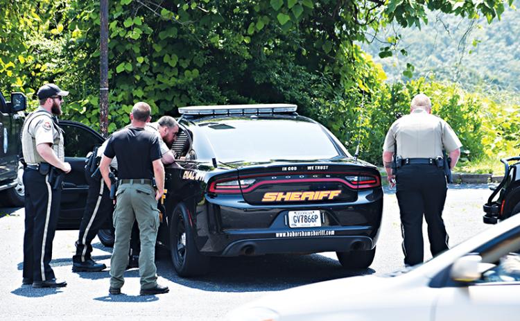 Habersham County Sheriff’s deputies help arrest Devonte Jenkins of Dalton on Wednesday afternoon.