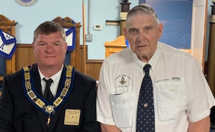 Pictured right is Brother Clarence Lewallen.