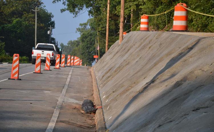 Demorest has its new wall almost finished, but the sidewalk above will still be closed during the holiday and beyond while the city waits for materials for the safety handrail. MATTHEW OSBORNE/Staff