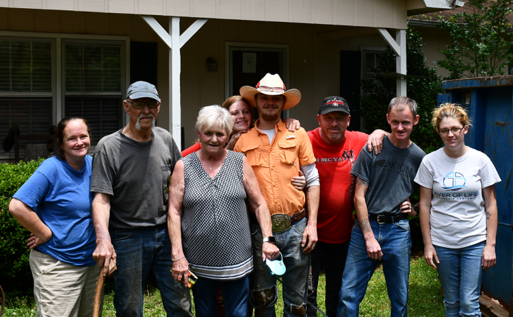 Family members help George and Pam (second and third from left) Anderson pack up their items in anticipation of the eviction coming the couple’s way. Left to right are Rachel Witcher, Tiffany Witcher, Austin Shedd, Robert Witcher, Nicholas Witcher and Whitney Witcher. JOHN DILLS/Staff