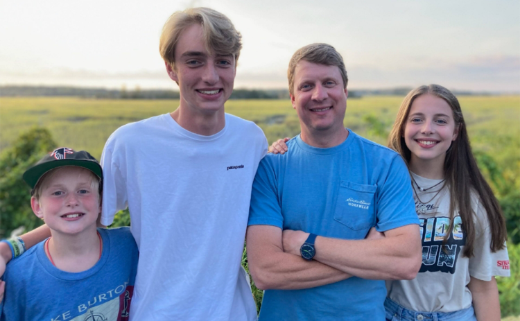 Toby Grady (second from right) takes a moment with his children (from left) Stephen, Jacob and Sarah Grace. SUBMITTED
