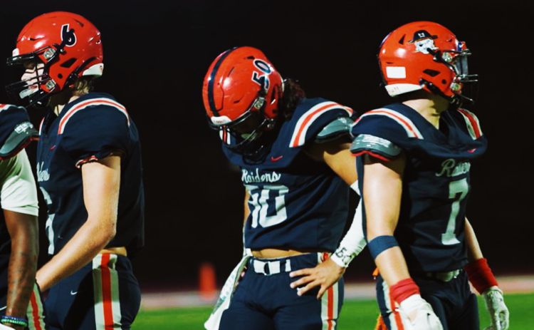 Habersham Central’s Alex Ethridge (50) and his teammates stand in disbelief after falling late Friday night to the Stephens County Indians. JAYDEN ARRIA/Special