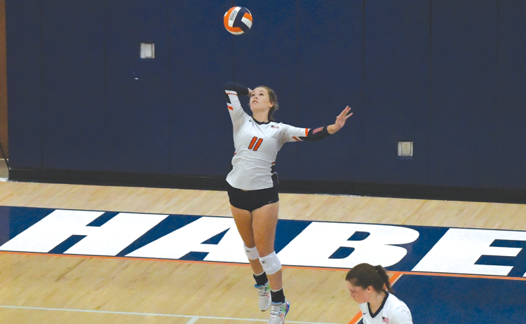 Habersham Central’s Jayden Jarrett serves during an earlier home match. LANG STOREY/Staff