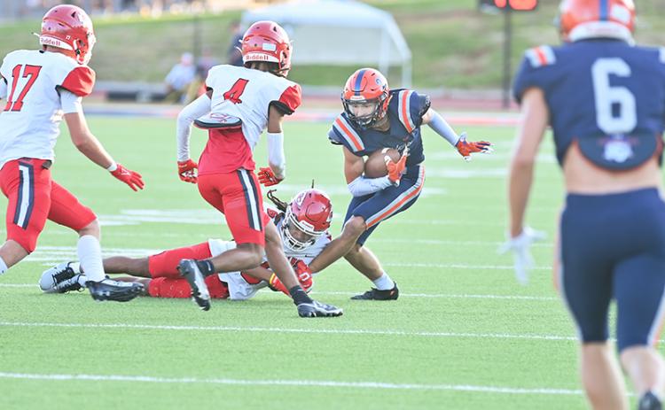 Habersham Central’s Landyn Savage avoids Stephens County tacklers during the season opener. TOM ASKEW/Special
