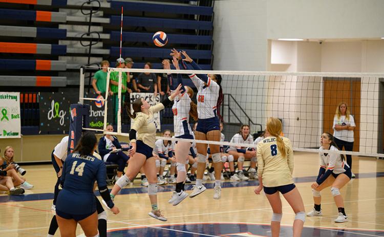 Habersham Central’s Da’Riyah Bell and Katelynn LoBuono get the block on the Apalachee attack and get the point for the Lady Raiders. ZACH TAYLOR/Special