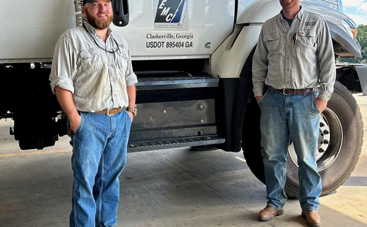 Habersham EMC linemen Jed Clark (left) and Isaac Wall prepare to depart for Guatemala. NICOLE DOVER/Submitted