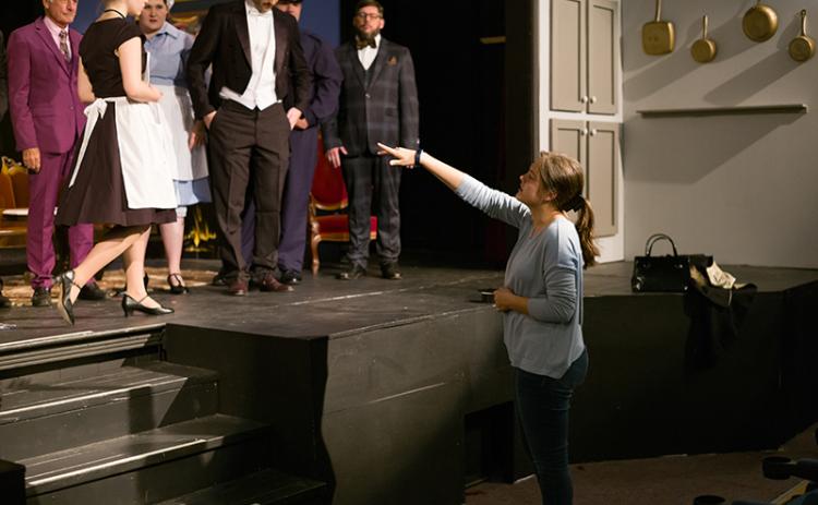 Annabelle Brackett directs cast members during a photo shoot on the ‘Clue’ set. ZACH TAYLOR/Special