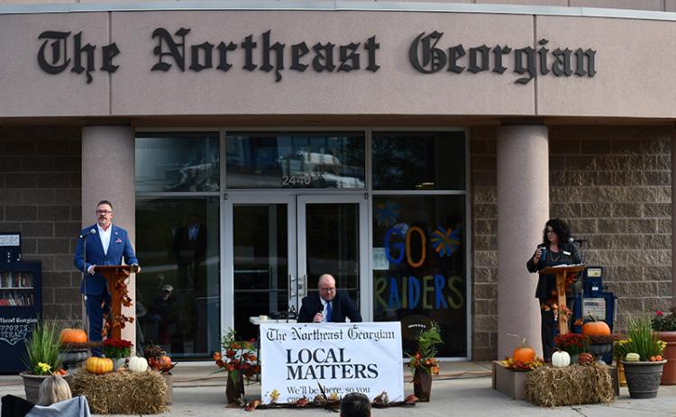 Baldwin mayoral candidates Tom Whitney (left) and Stephanie Almagno (right) listen to  questions from The Northeast Georgian editor Matthew Osborne during Tuesday’s debate. JULIANNE AKERS/Staff