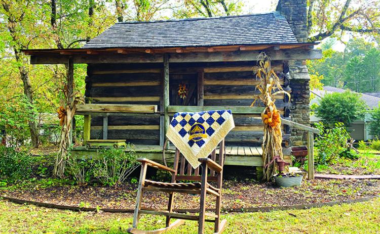 The Historic Mauldin House is shown with a one-of-a-kind Clarkesville  Bicentennial quilt which will be auctioned at the event this weekend. FILE