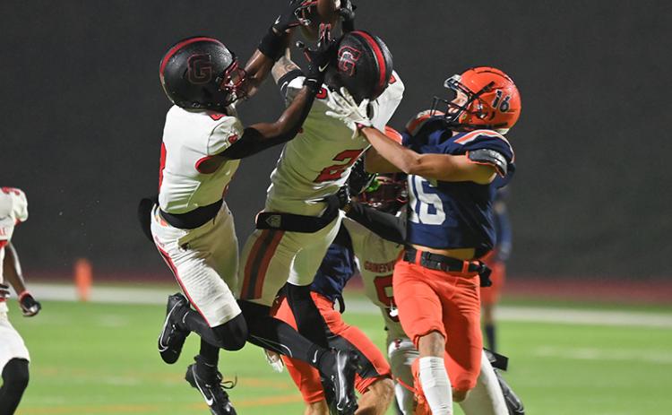 Gainesville’s Nicholas Taylor breaks up a pass intended for Habersham Central’s Maverick Chitwood (16) during Friday night’s game. TOM ASKEW/Special
