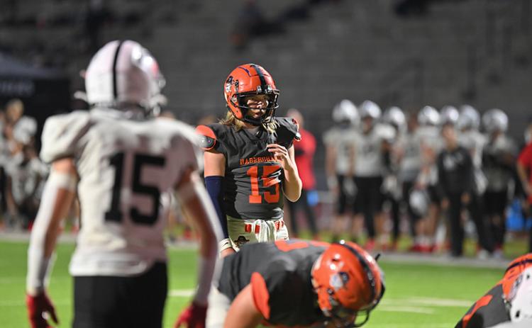 Habersham Central quarterback DJ Pass looks over the defense just before the snap during the Raiders’ win over Jackson County. TOM ASKEW/Special